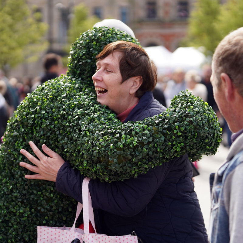 The Hedge Men Entertainers giving hugs at a food festival in Bishop Auckland.