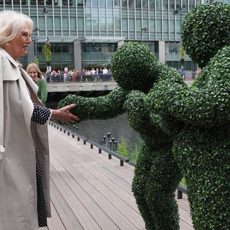 The Human Hedges meeting Queen Camilla at a garden opening event in London.