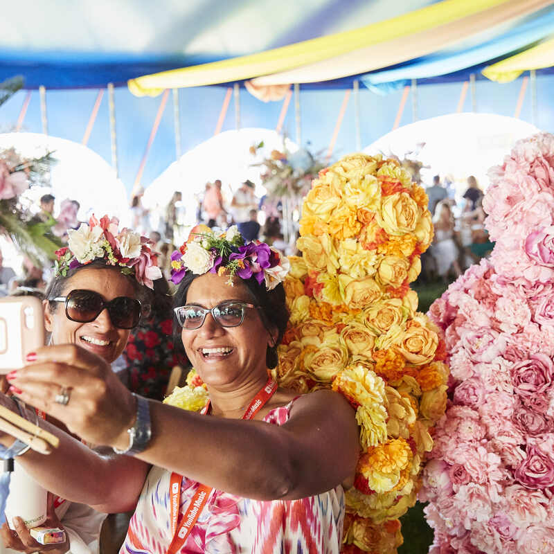 Guests enjoy the perfect selfie opportunity with The Flower People.