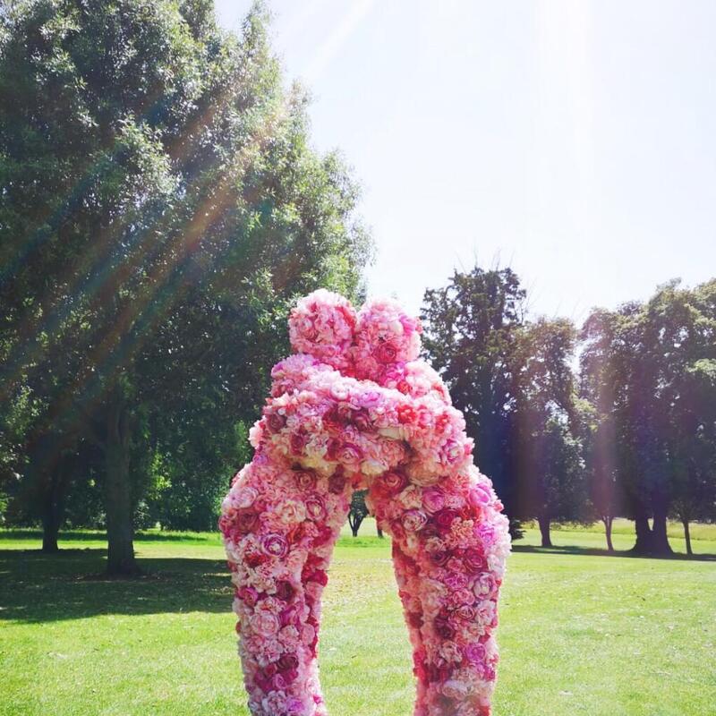Pink Hugs with the Flower People at a garden event.